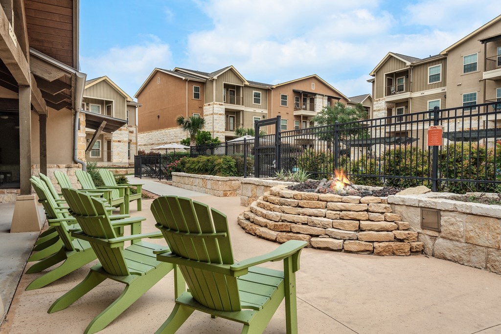 chairs and fire pit at the preserve at green valley apartments