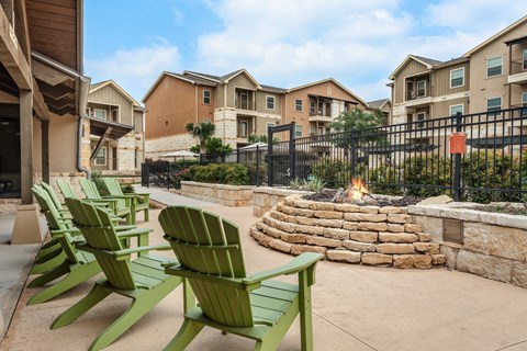 chairs and fire pit at the preserve at green valley apartments