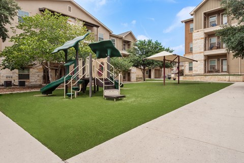 our apartments have a play area with a slide and grass