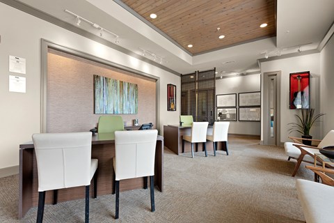 a dining room with a table and chairs