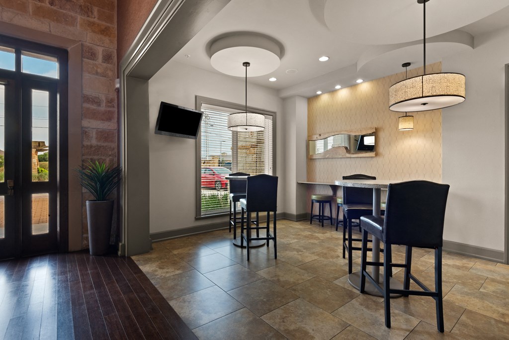 a dining room with a table and chairs and a television