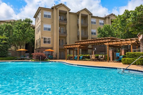 the swimming pool at the preserve at polo terrace apartments