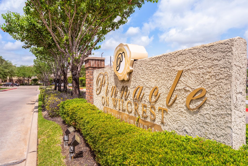 a sign for the omni hotel sign on the side of a road