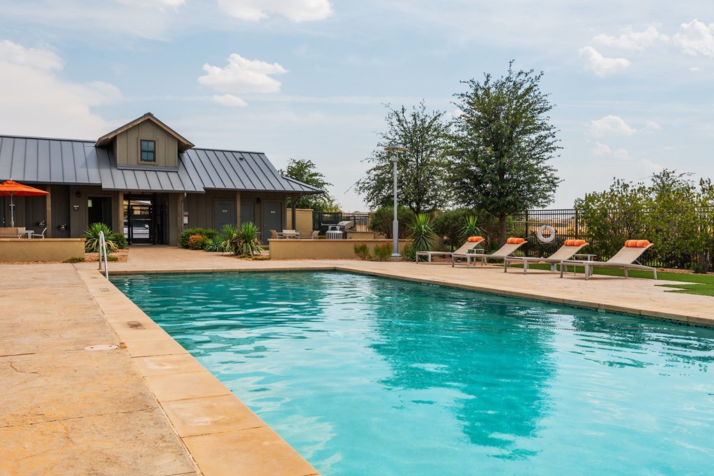 a pool with a house in the background