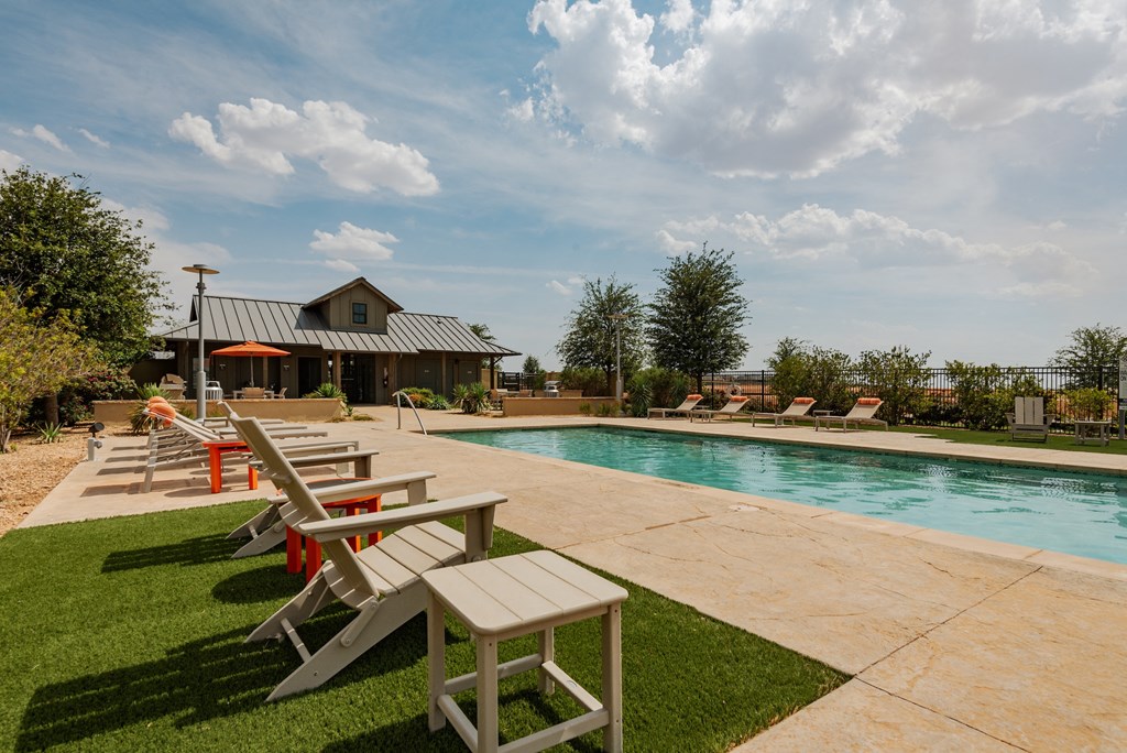 take a dip in the pool at the whispering winds apartments in pearland, tx