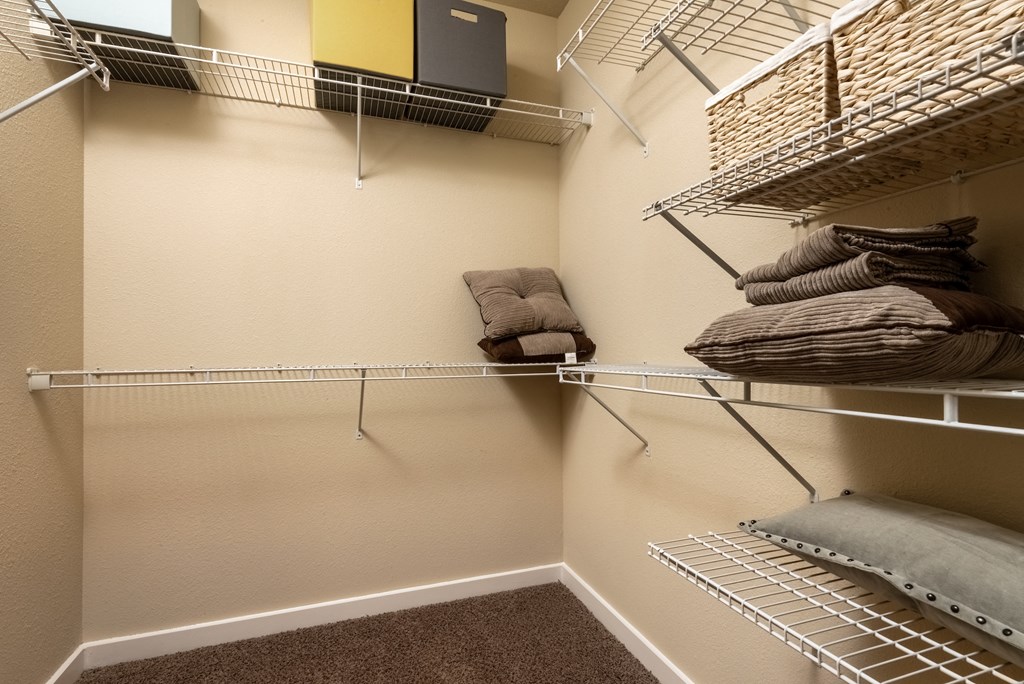 a spacious walk in closet in a bedroom plus den unit