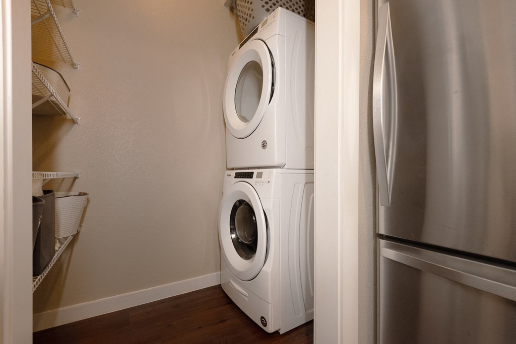 a washer and dryer in a small laundry room