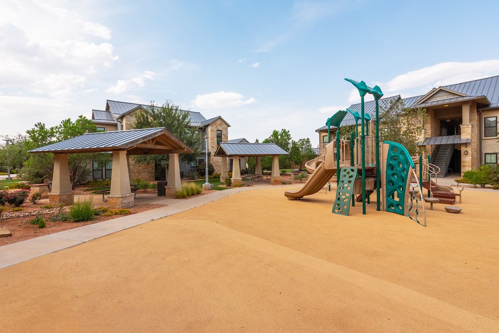 a playground at the whispering winds apartments in pearland, tx