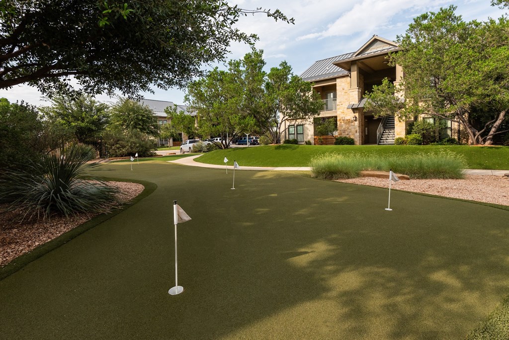 a putting green in front of a building