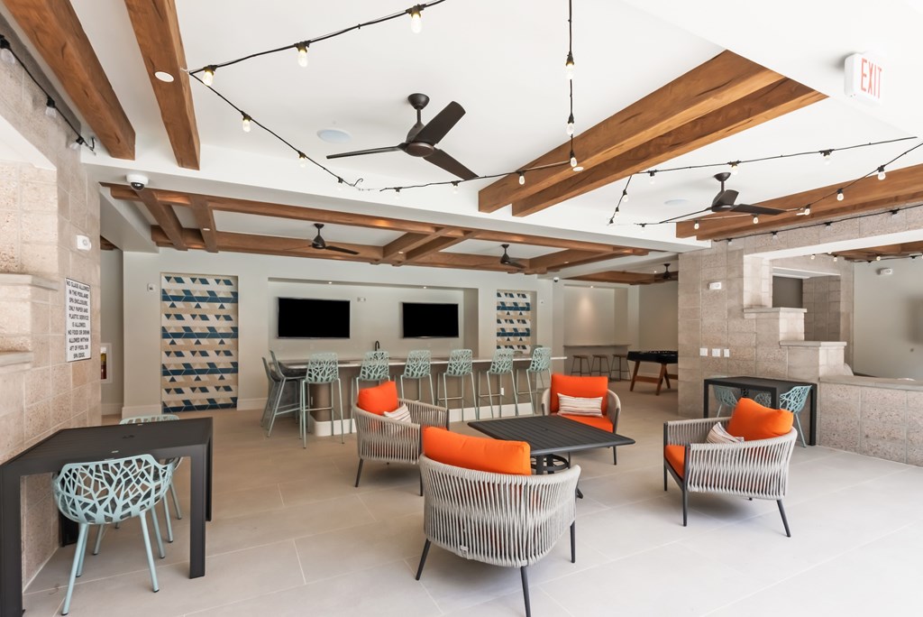 A room with a lot of chairs and a table.