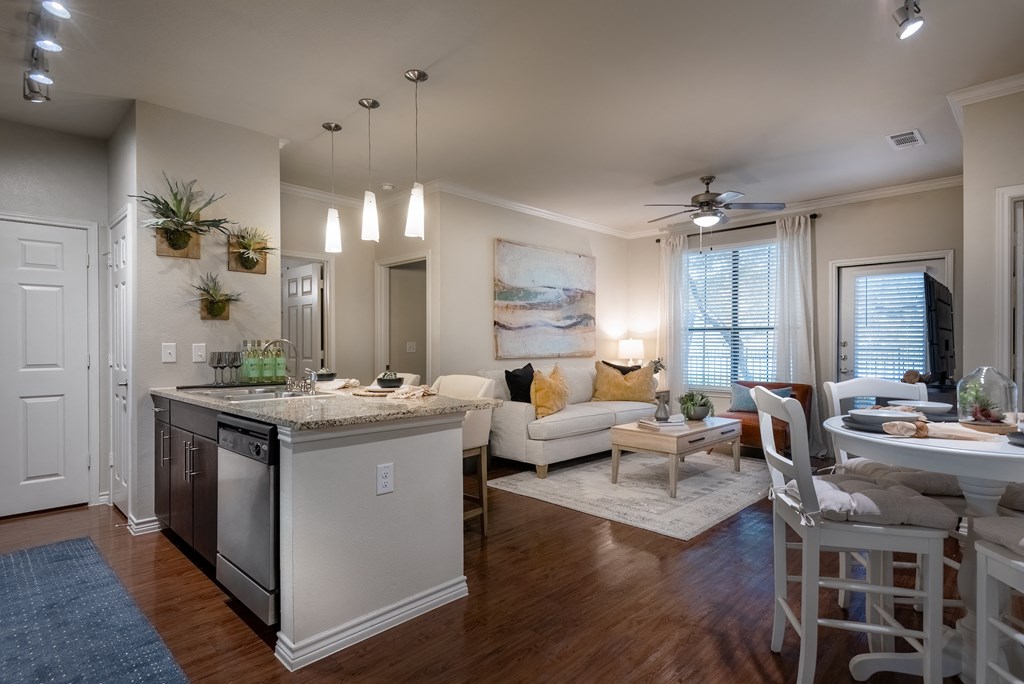 an open floor plan with a kitchen and living room