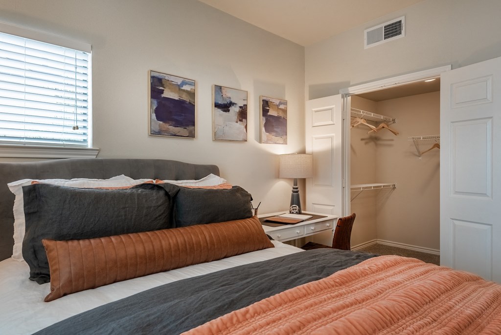 a bedroom with a bed and a closet