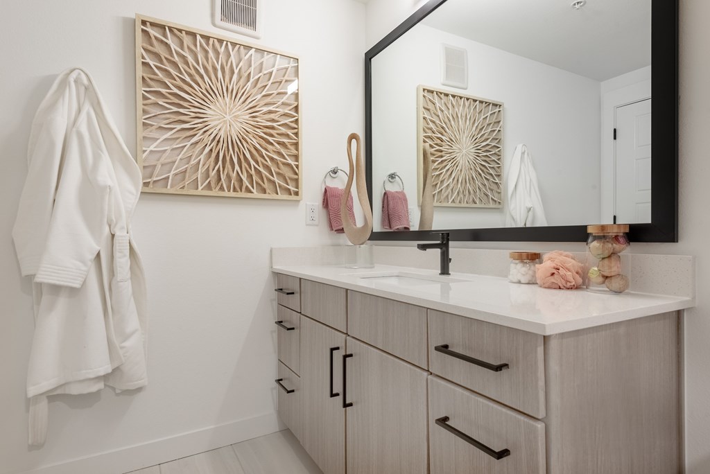 A bathroom with a white towel hanging on the wall.