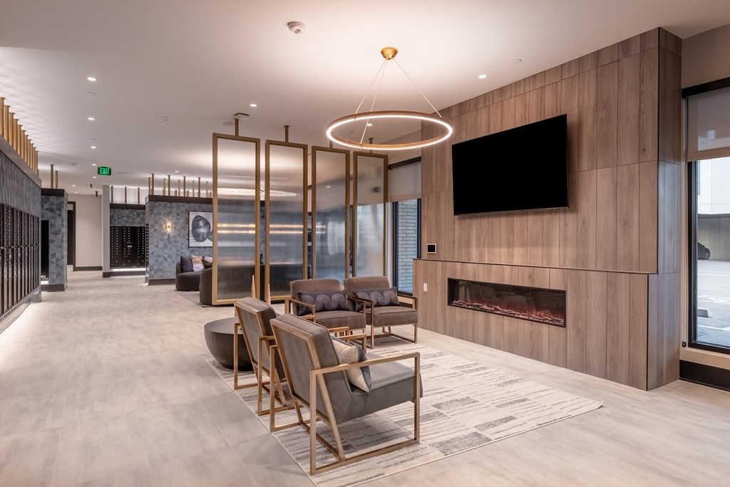 A modern living room with a fireplace and a television.