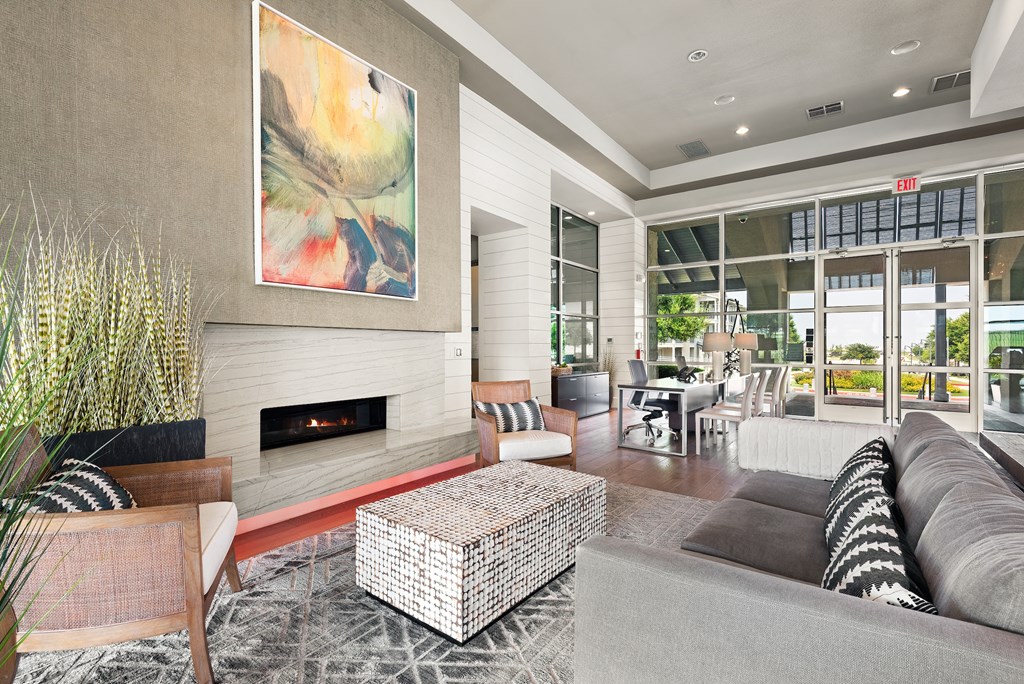 a living room filled with furniture and a fireplace