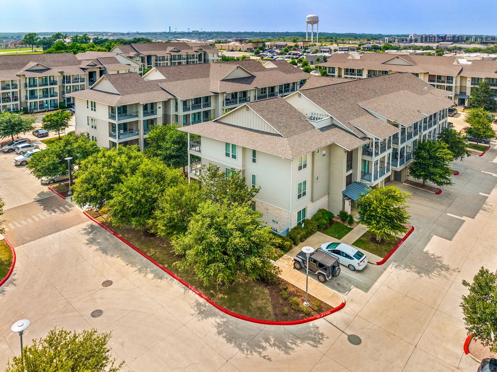 an aerial view of the leasing office at the enclave at woodbridge apartments in sugar land,