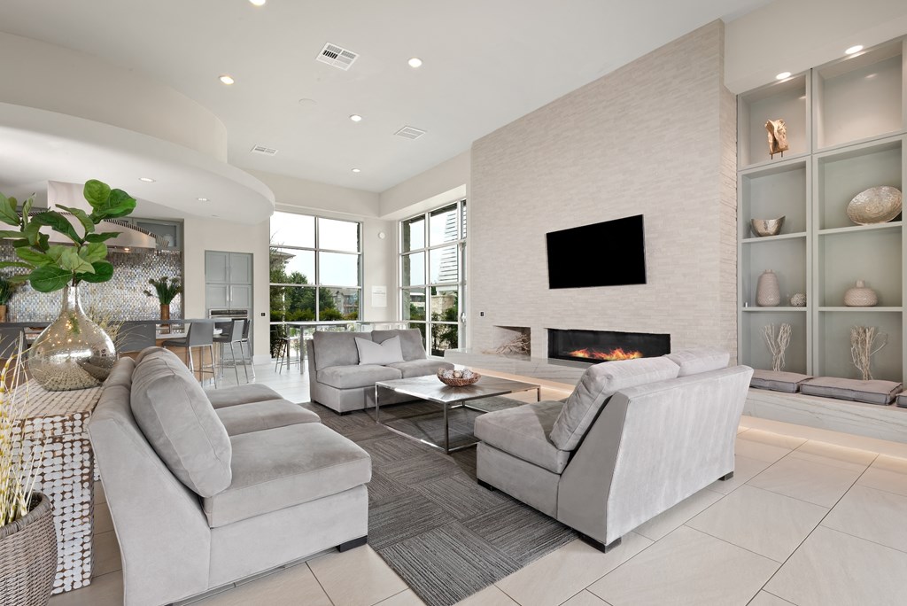 a living room with a fireplace and two couches