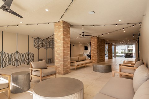 a living room with couches and chairs and a table