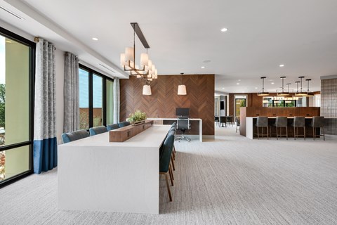 a large room with a long white table and chairs