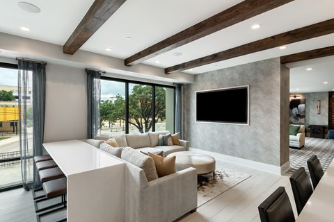 a living room filled with furniture and a large flat screen tv