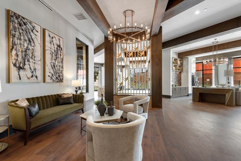 a living room filled with furniture and a large chandelier