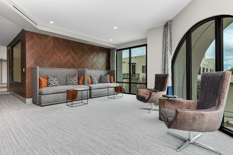 a living room with a couch and chairs