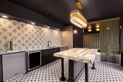 a kitchen with a marble counter top and a glass door