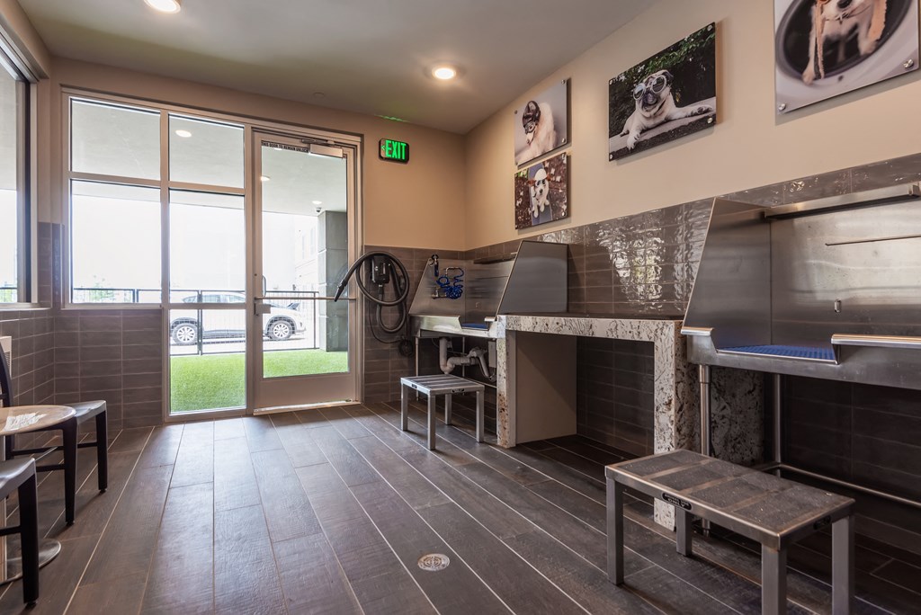 a room with a fireplace and tables and chairs  at Encore at Boulevard One, Denver