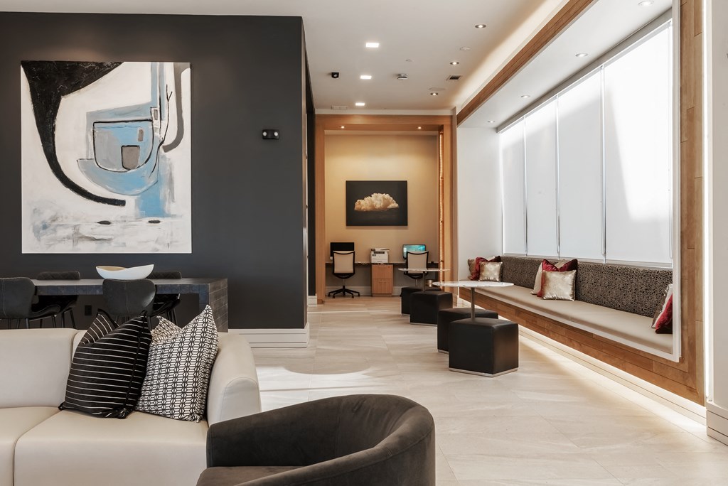 a living room filled with furniture and a large window  at Encore at Boulevard One, Colorado, 80230