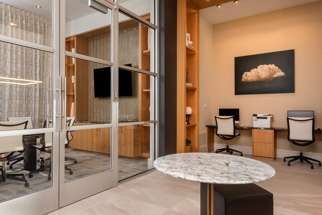 an office with glass doors and a marble table  at Encore at Boulevard One, Denver, CO