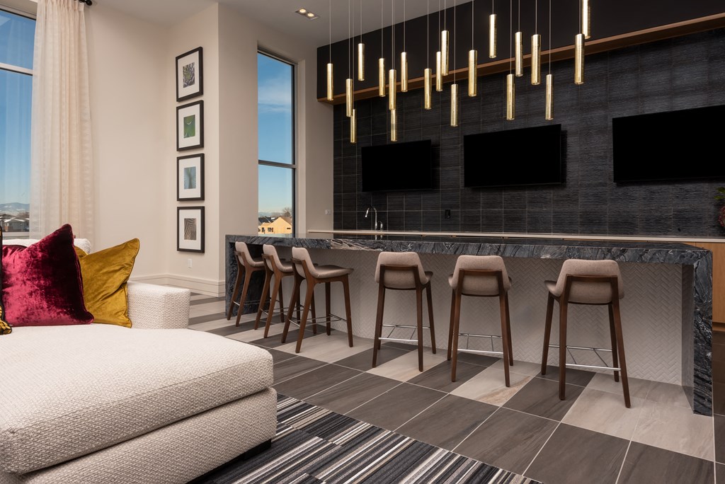 a living room filled with furniture and a large window  at Encore at Boulevard One, Colorado