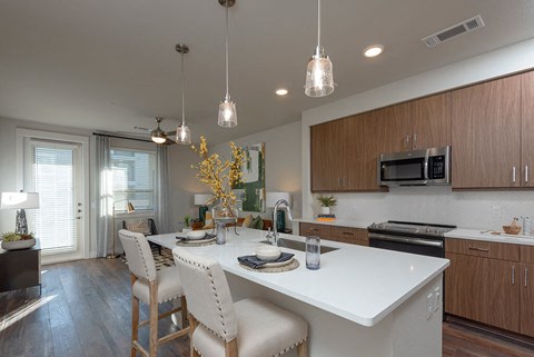 a kitchen with a white counter top
