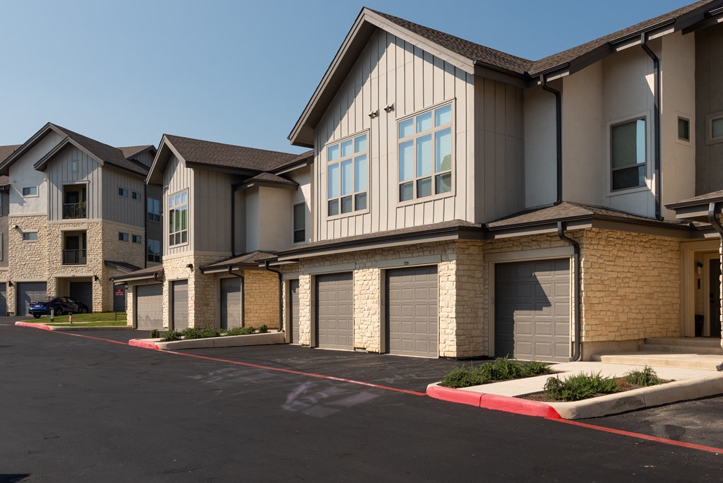 an empty parking lot in front of a building