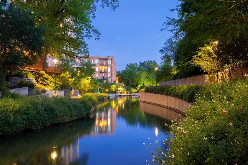 a river running through a city at night