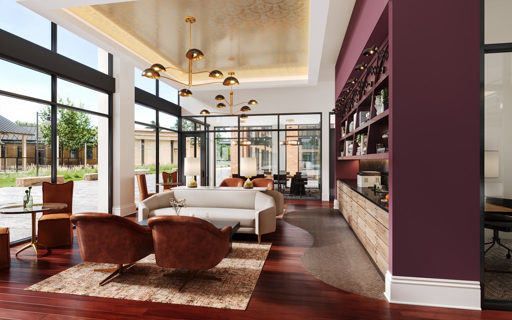 A living room with a white sofa and a brown rug.