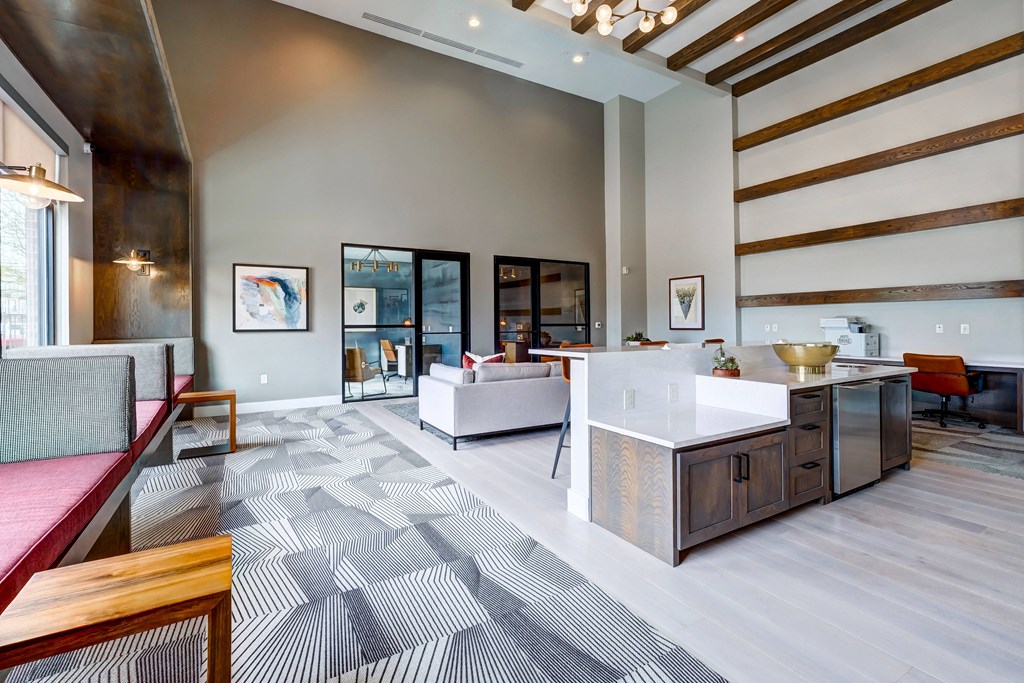 a spacious living room with a kitchen and dining area