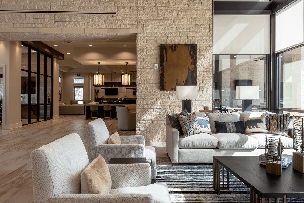 a living room with two couches and chairs and a table