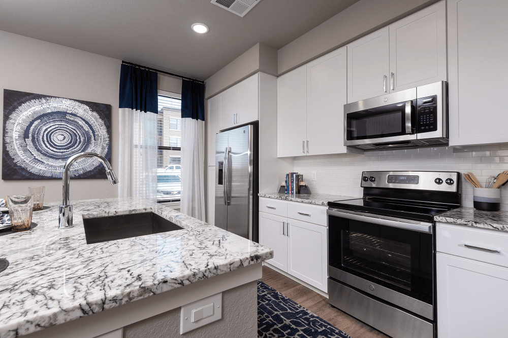 Kitchen With Appliances at Escape at Arrowhead's Apartments in Glendale, AZ