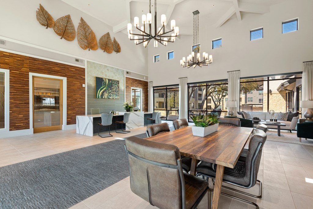 a dining room with a wooden table and chairs