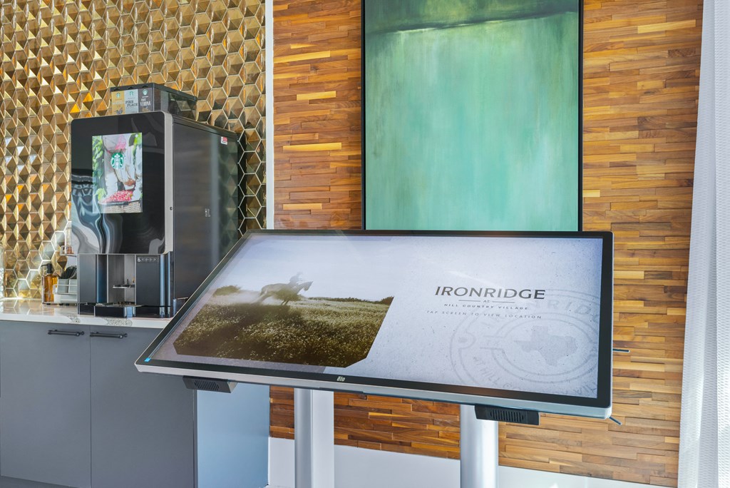 a table with a picture on it next to a coffee machine