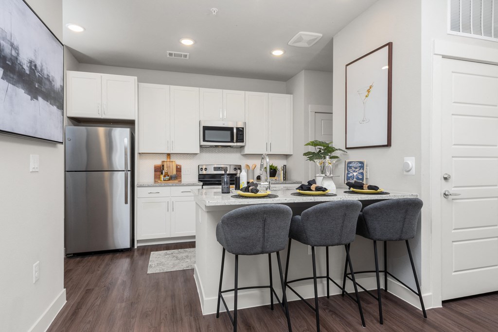 kitchen of an apartment at ironridge at hill country village