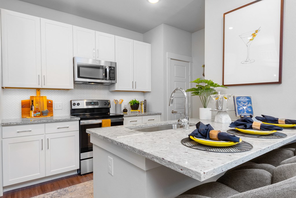 kitchen area of an apartment at ironridge at hill country village