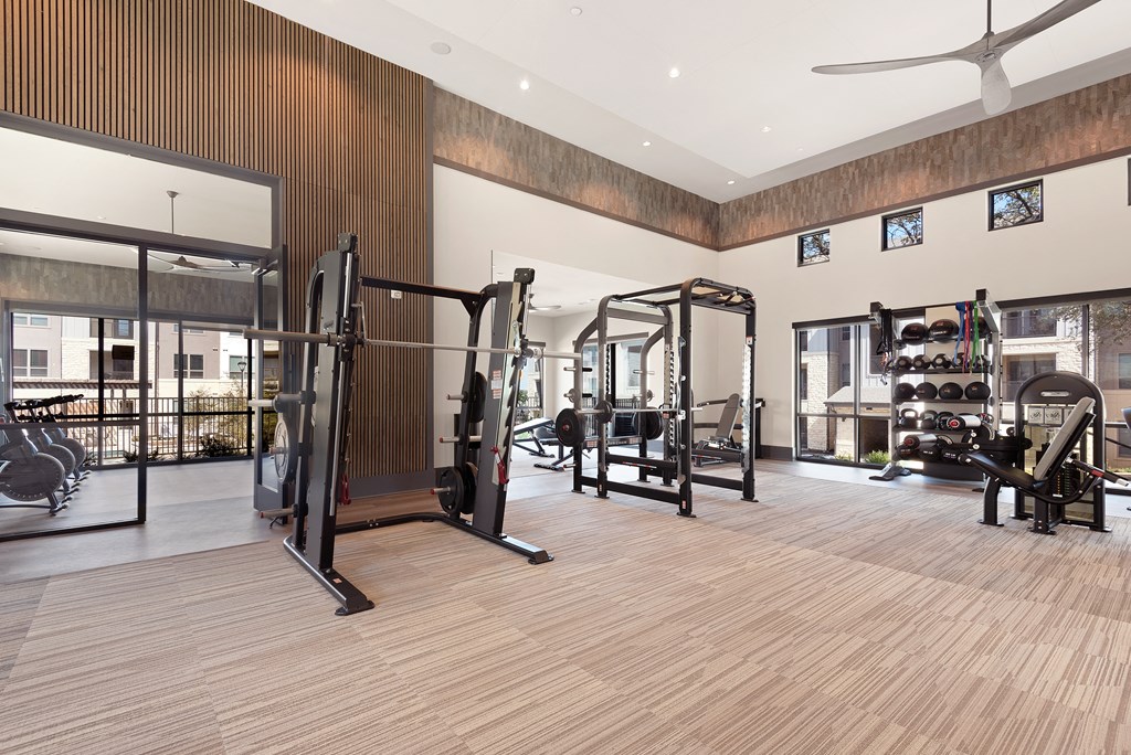 gym with amenities at ironridge at hill country village apartments