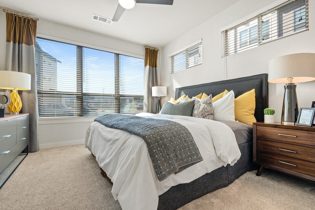 bedroom area of an apartment at ironridge at hill country village