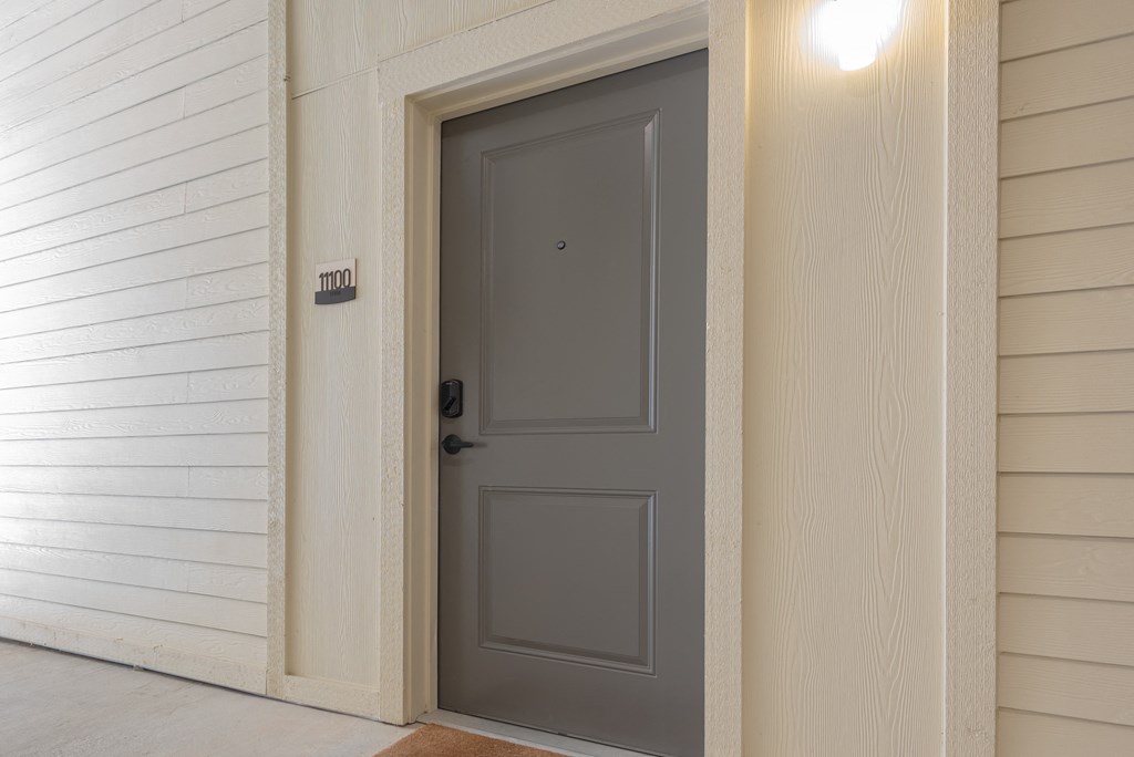 front door of an apartment at ironridge at hill country village