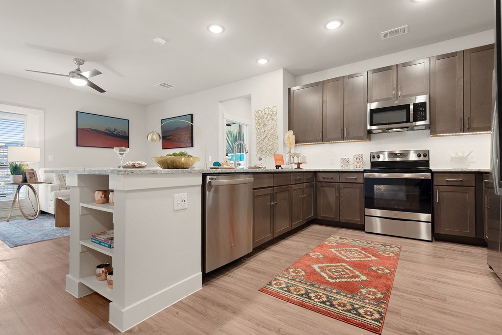 fully furnished kitchen area of an apartment at ironridge