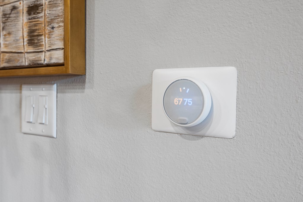 thermostat inside of an apartment at ironridge at hill country village