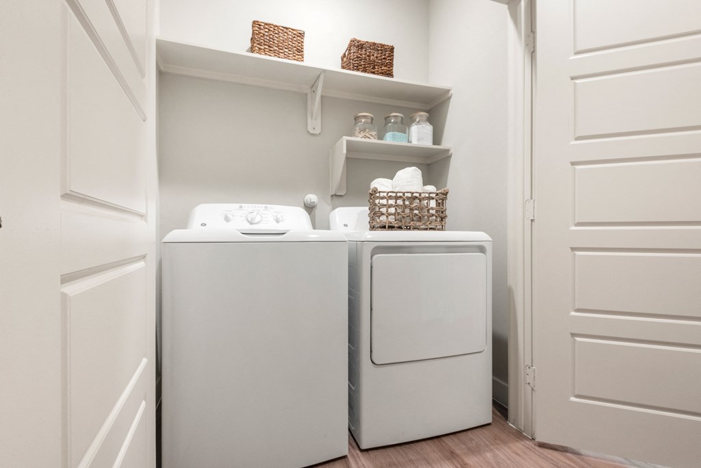 washer and dryer of an apartment at ironridge at hill country village