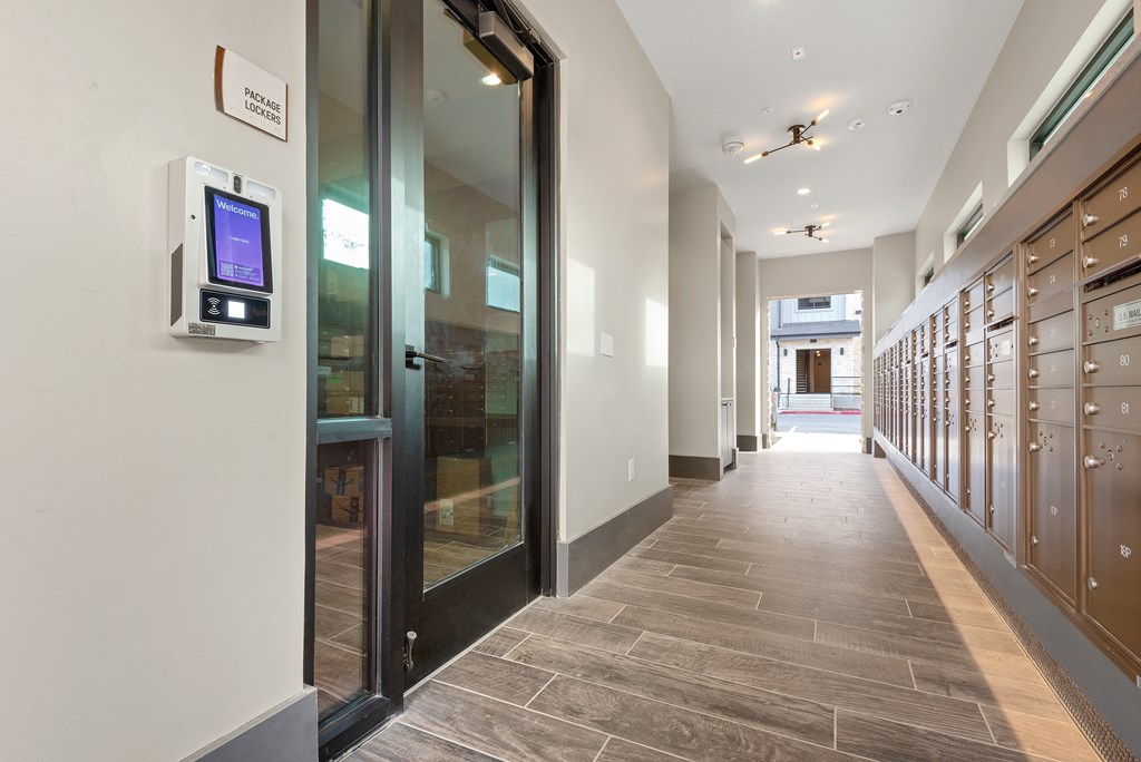 a hallway with lockers and doors in a building