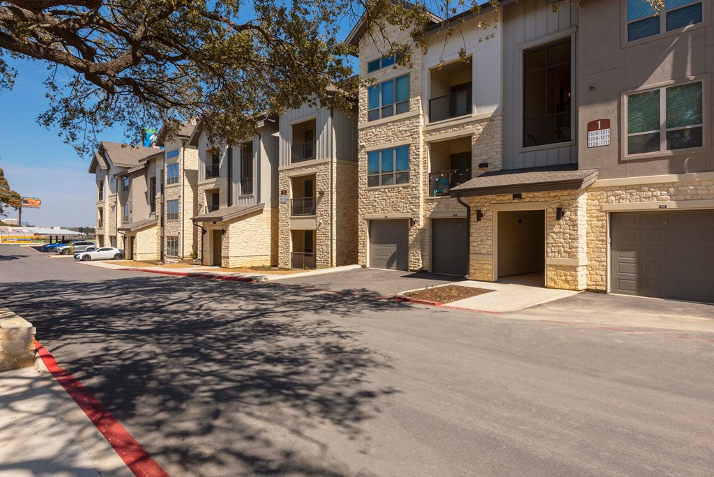 a row of apartment buildings on a city street